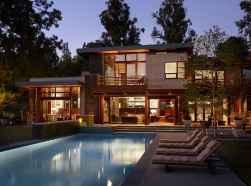 Irregularly shaped house with a small grove of eucalyptus and pine trees 32 554x354