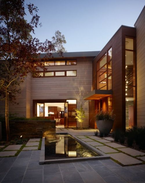 Irregularly shaped house with a small grove of eucalyptus and pine trees 32 554x354