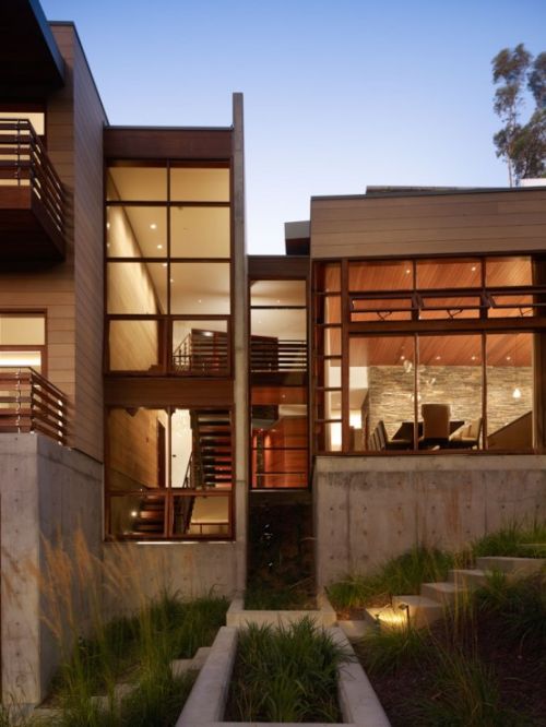 Irregularly shaped house with a small grove of eucalyptus and pine trees 32 554x354