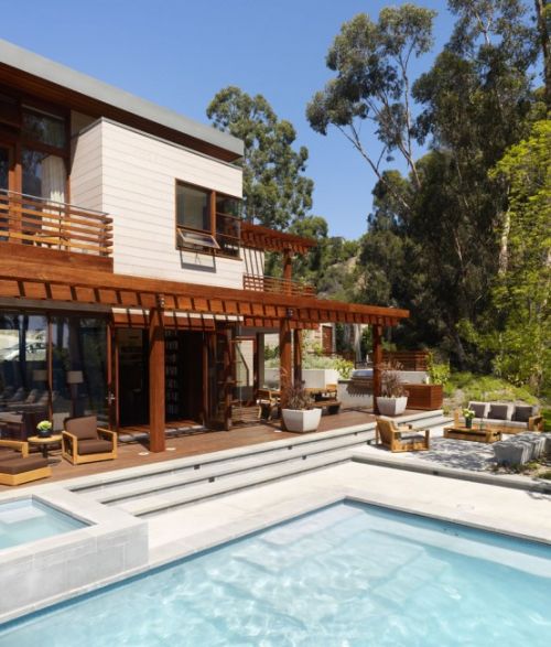 Irregularly shaped house with a small grove of eucalyptus and pine trees 32 554x354